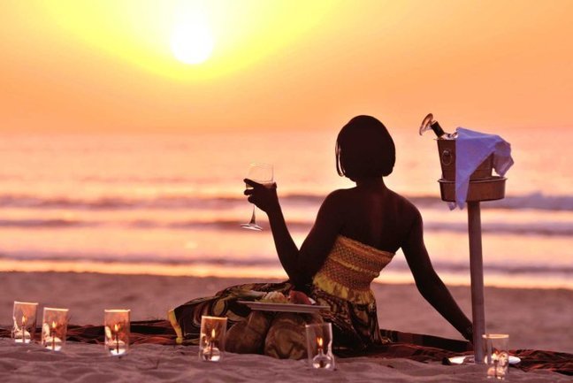 Woman relaxing on beach near Coco Ocean Resort