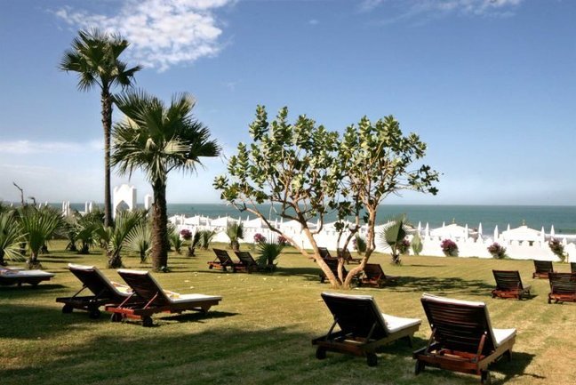 Lawns leading down to the beach at Coco Ocean