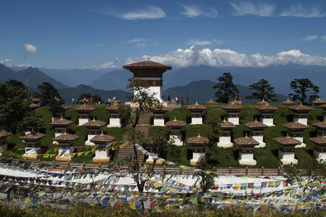 monument with 108 chorten on the dochu la pass - druk wangyal - and himalaya range in background