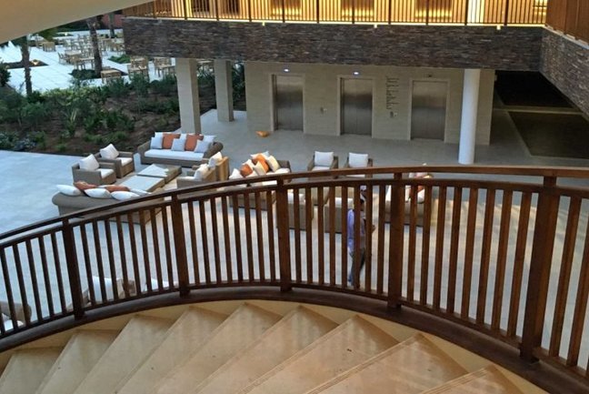 Winding staircase overlooking reception area