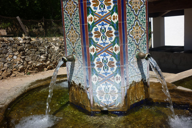 A pretty, tiled public fountain
